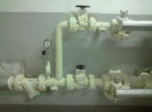 Professional hot pipe coating application on industrial brewery piping system using high performance coating technology